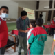 A medical team member examines a student during heart screening at Paathsala School, August 2026