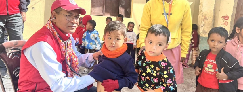 Rotary and medical team members with children during the Sindhupalchowk heart-screening programme
