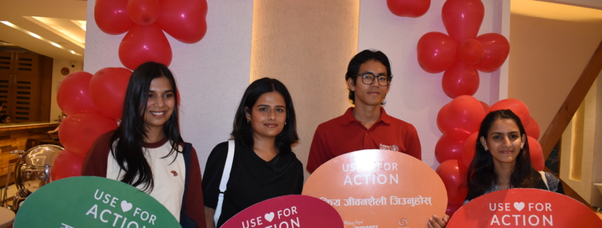Participants holding heart-health awareness messages at the World Heart Day programme