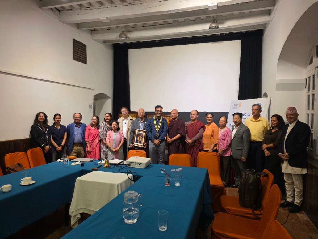 Group photo of Rotary Club of Patan members, guests and Rotaractors after the Faces of Buddha programme, 12 October 2026.