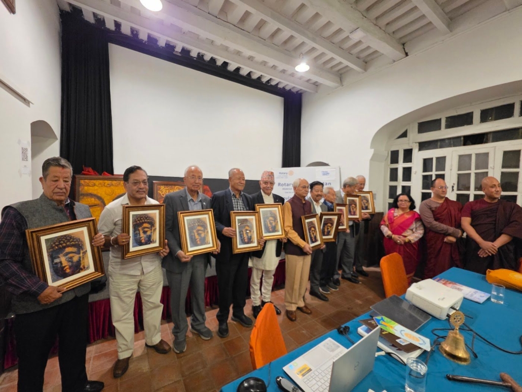 Senior members of the Rotary Club of Patan holding framed “Inner Peace” Buddha artwork presented by Rtn. Sandhya Regmi, 12 October 2026.