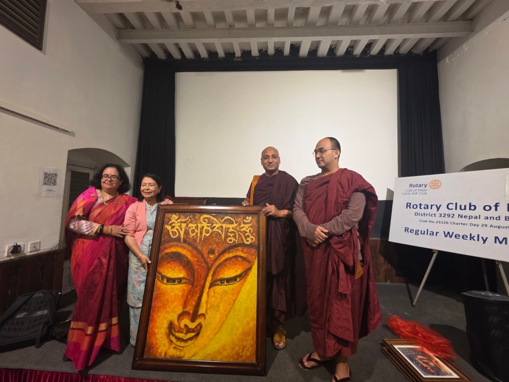 Rtn. Sandhya Regmi with the visiting Venerable Monks beside one of her large Buddha paintings at Yala Maya Kendra, 12 October 2026.