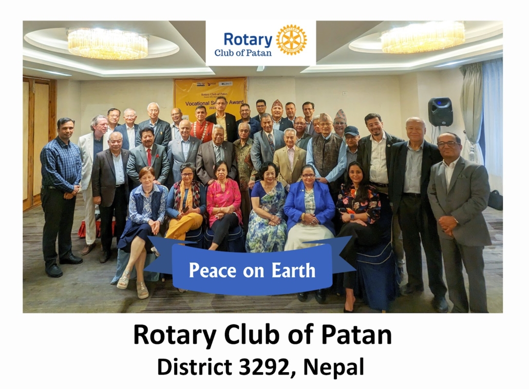 Group photograph of Rotary Club of Patan members and guests with a “Peace on Earth” banner, 15 April 2024.
