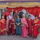 Rotarians, Rotaractors and guests gather in front of the decorated red-and-white stage at the Good Morning Tea Party, Bluebird Secondary School, 17 October 2026.